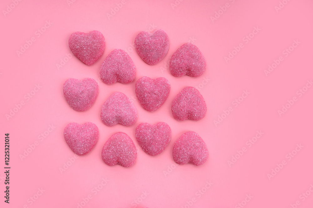 Obraz premium Pink heart candy on pink background. Save for text. Valentine's Day background