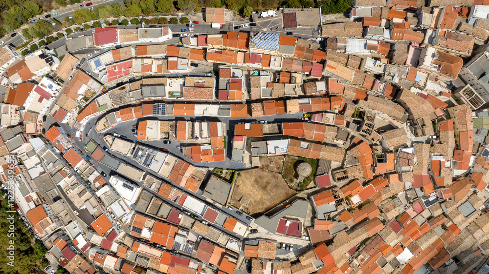 Fototapeta premium Aerial perpendicular view of the town of Rotondella located on a hill in Basilicata, Italy.