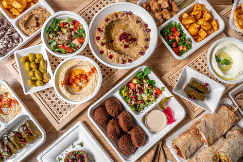 Fényképezés Composition from above with typical Lebanese and Middle Eastern dishes, with fal