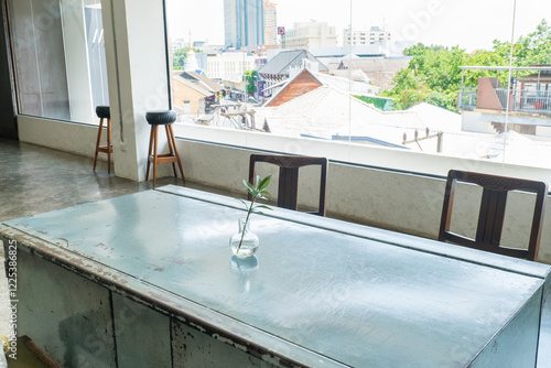 Photography Empty Table and chair in Korean restaurant or minimal cafe style with view of city in seoul korea,cafe japan or korea concept