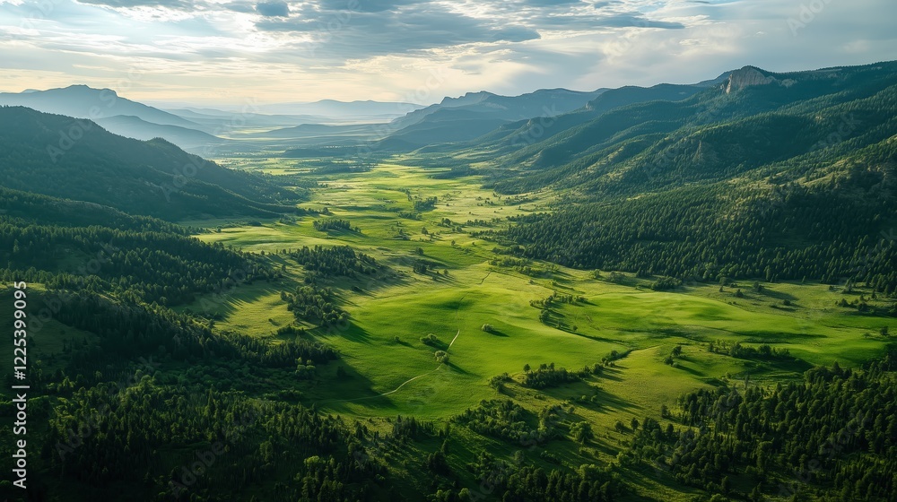 Obraz premium The green valley unfolds with rolling hills and vibrant foliage, a perfect haven for exploration and discovery.