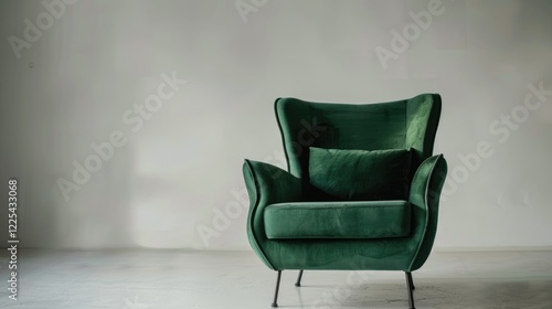 Contemporary green velvet armchair with metal legs on white backdrop. Furniture Compilation photo