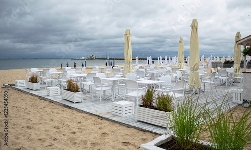 Fototapeta Naklejka Na Ścianę i Meble -  Cloudy summer morning on the Baltic Sea coast. Beach in Sopot