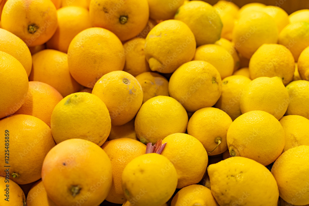 Bright yellow lemons displayed on a farmer's market stall, surrounded by fresh produce, embodying healthy living, nutrition, and organic choices Bright yellow lemons displayed on a farmer's market stall, surrounded by fresh produce, embodying healthy living, nutrition, and organic choices