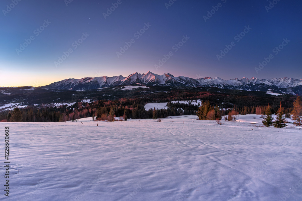 Winter sunrise on the meadow under the Tatra Mountains. Poland Winter sunrise on the meadow under the Tatra Mountains. Poland