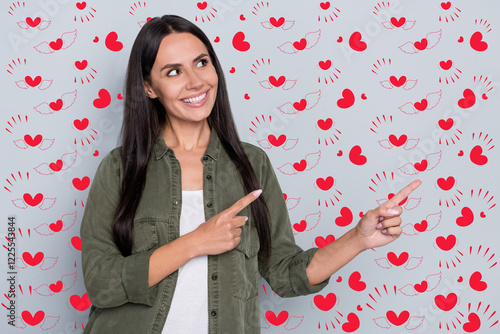 Portrait of cheerful charming person look direct fingers empty space news isolated on grey color background