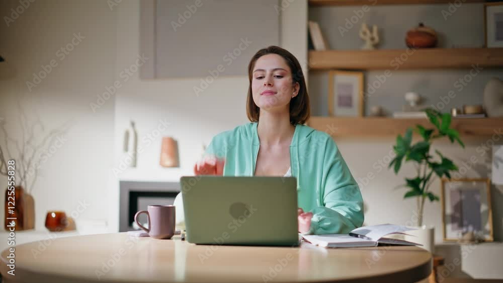 Satisfied businesswoman closing laptop at home remote workplace. Smiling woman Satisfied businesswoman closing laptop at home remote workplace. Smiling woman
