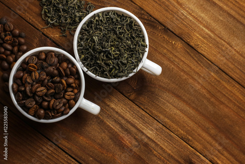 Coffee beans and tea leaves on table. Spices. Concept of taste and choice                      