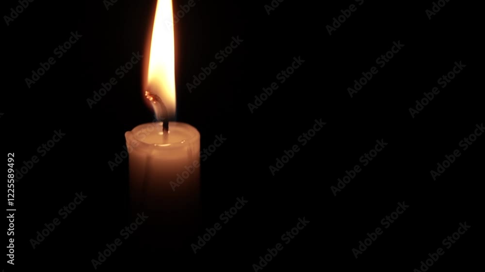 Lone Candle Flame Illuminating the Darkness Lone Candle Flame Illuminating the Darkness