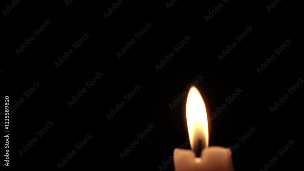 Lone Candle Flame Illuminating the Darkness Lone Candle Flame Illuminating the Darkness