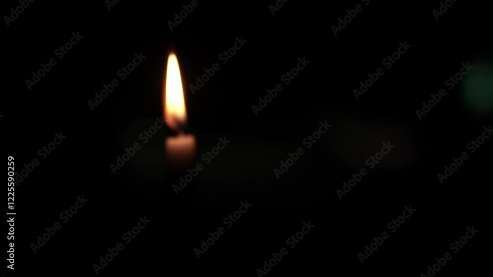 Lone Candle Flame Illuminating the Darkness Lone Candle Flame Illuminating the Darkness