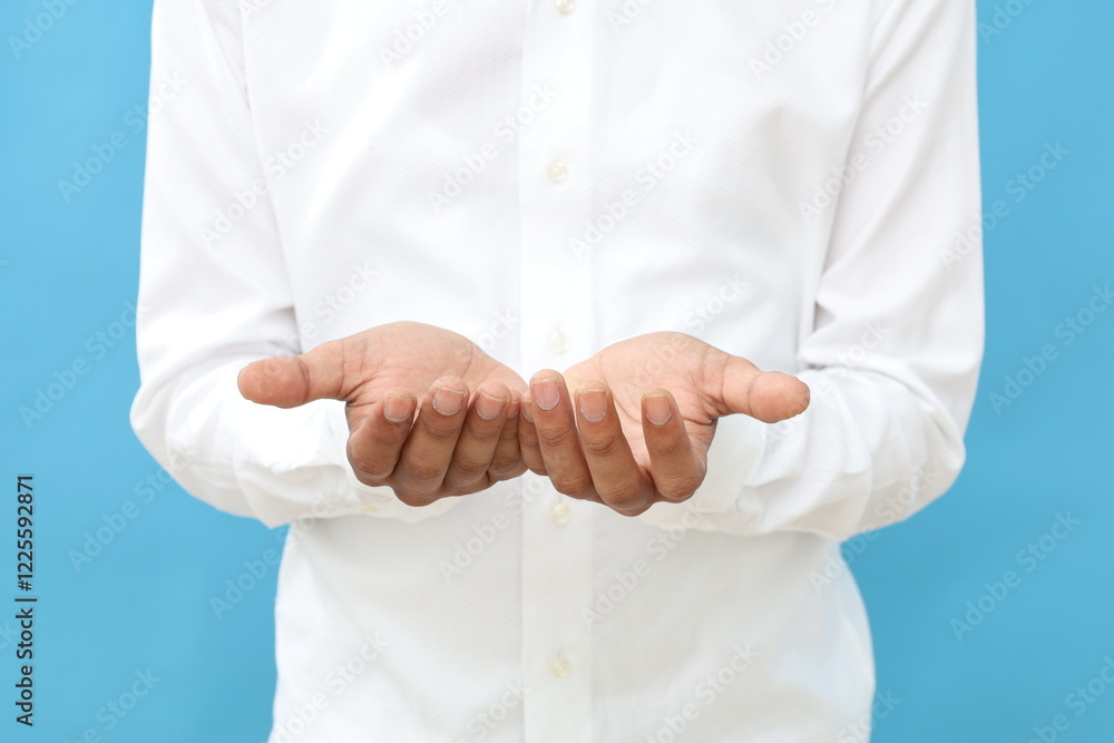 Close up photo of asian muslim man hand with praying hand gesture Close up photo of asian muslim man hand with praying hand gesture