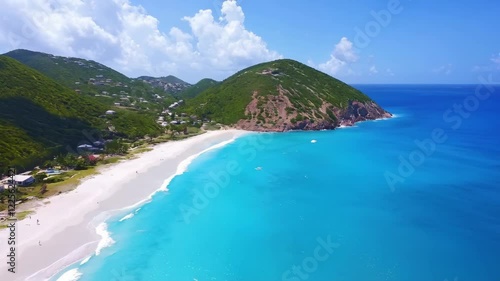 Aerial View of Tropical Beach with Turquoise Waters and Green Hills