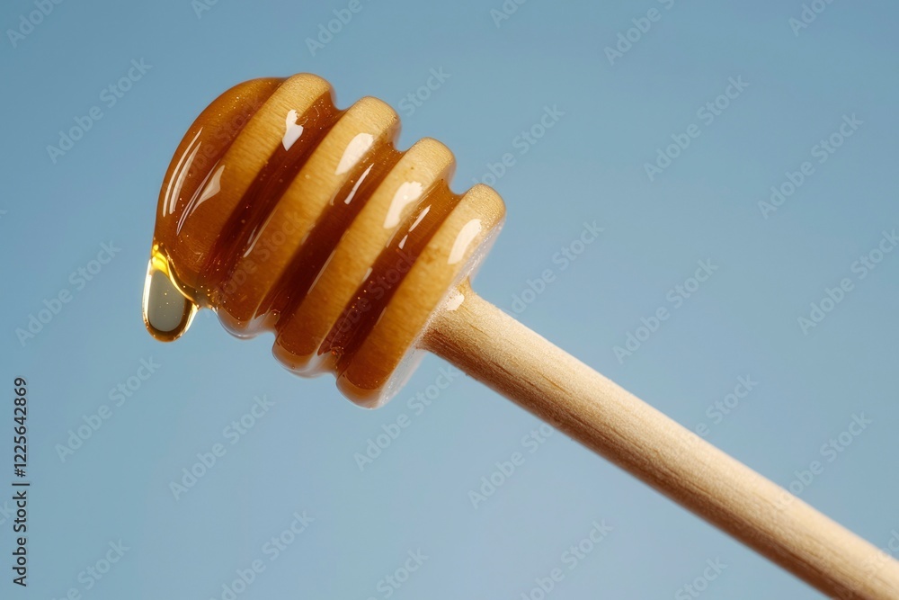 Golden Honey Dripping From Wooden Dipper Golden Honey Dripping From Wooden Dipper
