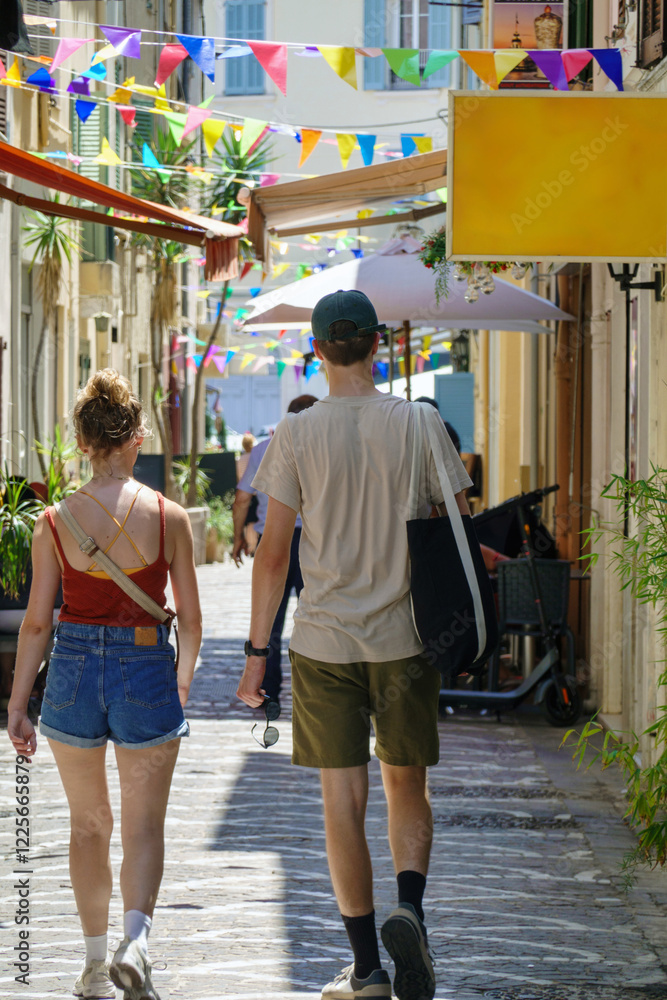 People walking on the street in summer time in Vallauris, France