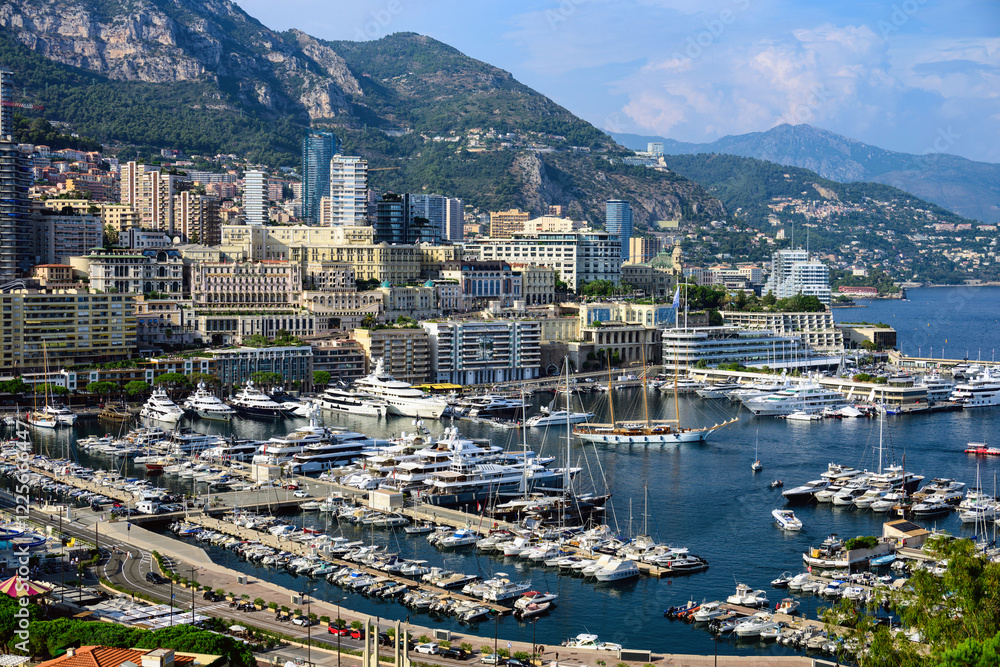 Monaco Monte Carlo buildings and port in summer, sea and mountains