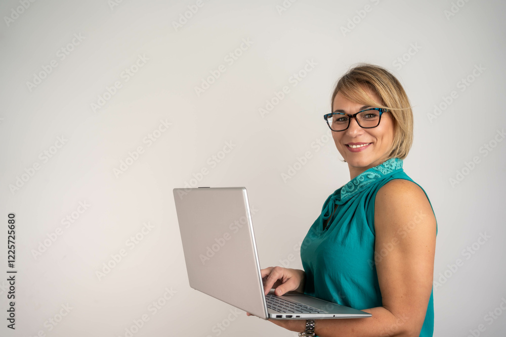 Beautiful Businesswoman typing on laptop
Beautiful Businesswoman typing on laptop