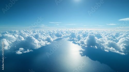 An airplane window view during the day, showing scattered clouds and the vast blue ocean below. photo