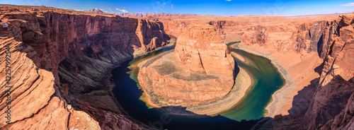 A river is winding through a canyon, with the water appearing to be green