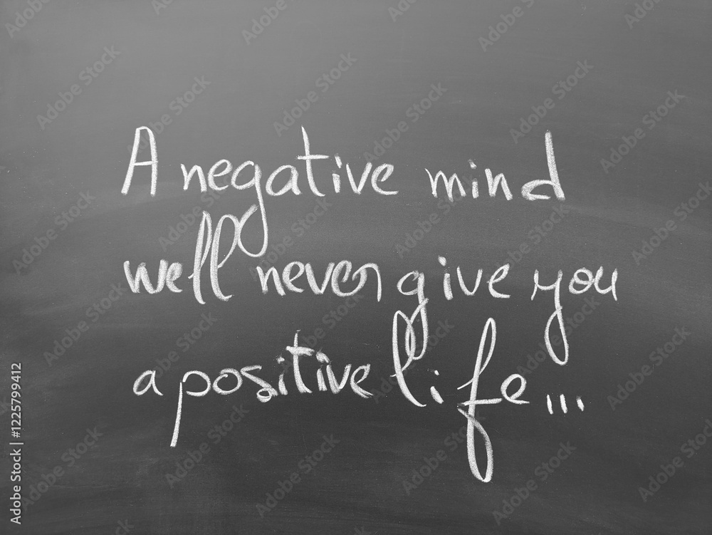 Obraz premium Inspirational quote handwritten on a chalkboard: 'a negative mind will never give you a positive life'