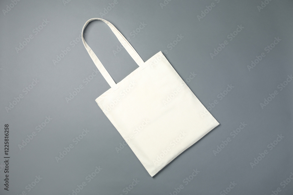One shopping bag on grey background, top view. Mockup for design One shopping bag on grey background, top view. Mockup for design
