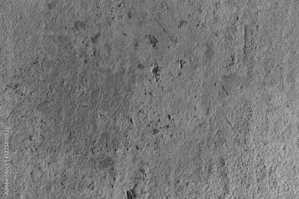 Fototapeta premium Textured surface showing natural patterns and signs of erosion in a rocky area