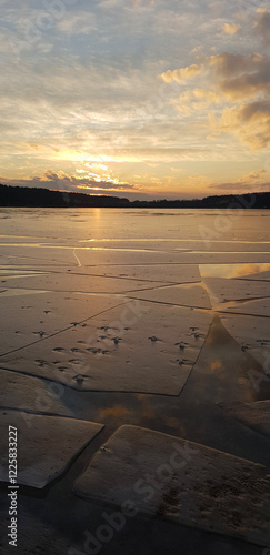 Sunset over the frozen lake