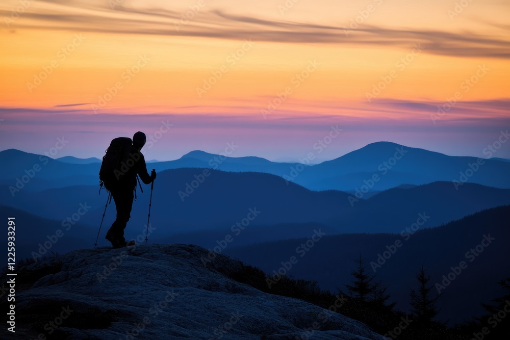 Silhouette of a hiker with backpack and trekking poles enjoying sunset over layered mountain ranges. Silhouette of a hiker with backpack and trekking poles enjoying sunset over layered mountain ranges.