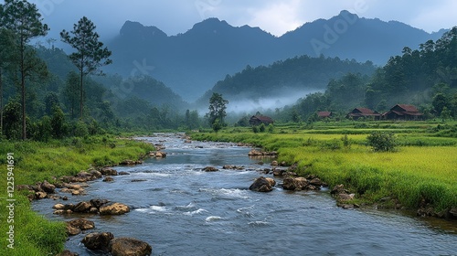 River flows through misty mountain valley farmland