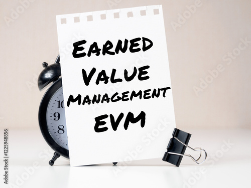 Earned Value Management EVM header on white note paper background alarm clock