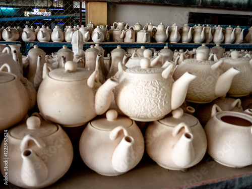 Unglazed handcrafted teapots in a Thai pottery workshop. 