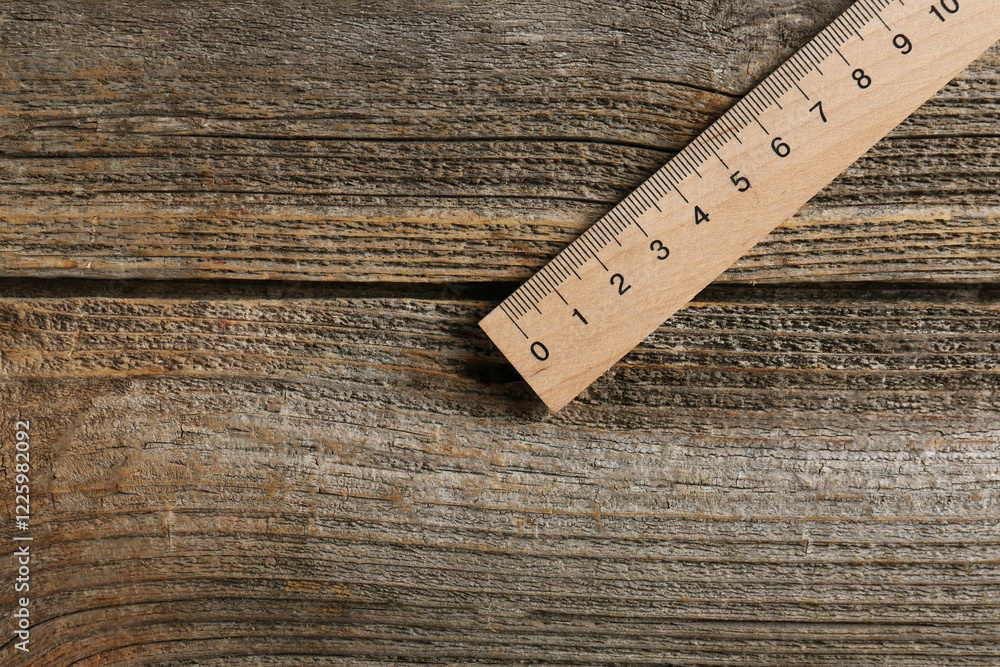 One ruler on wooden table, top view. Space for text One ruler on wooden table, top view. Space for text