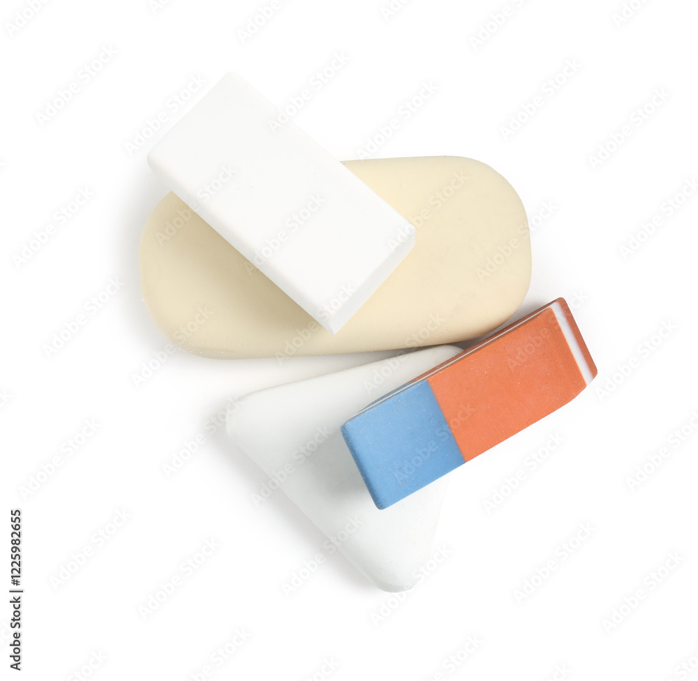 Different new erasers isolated on white, top view. School stationery Different new erasers isolated on white, top view. School stationery