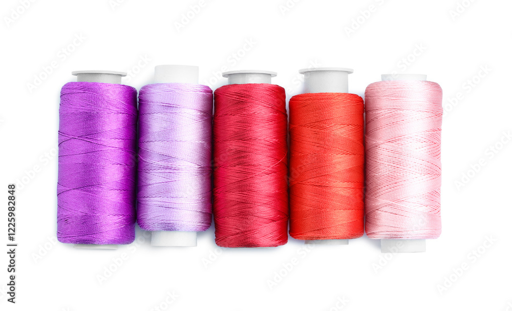 Spools of bright sewing threads isolated on white, top view Spools of bright sewing threads isolated on white, top view