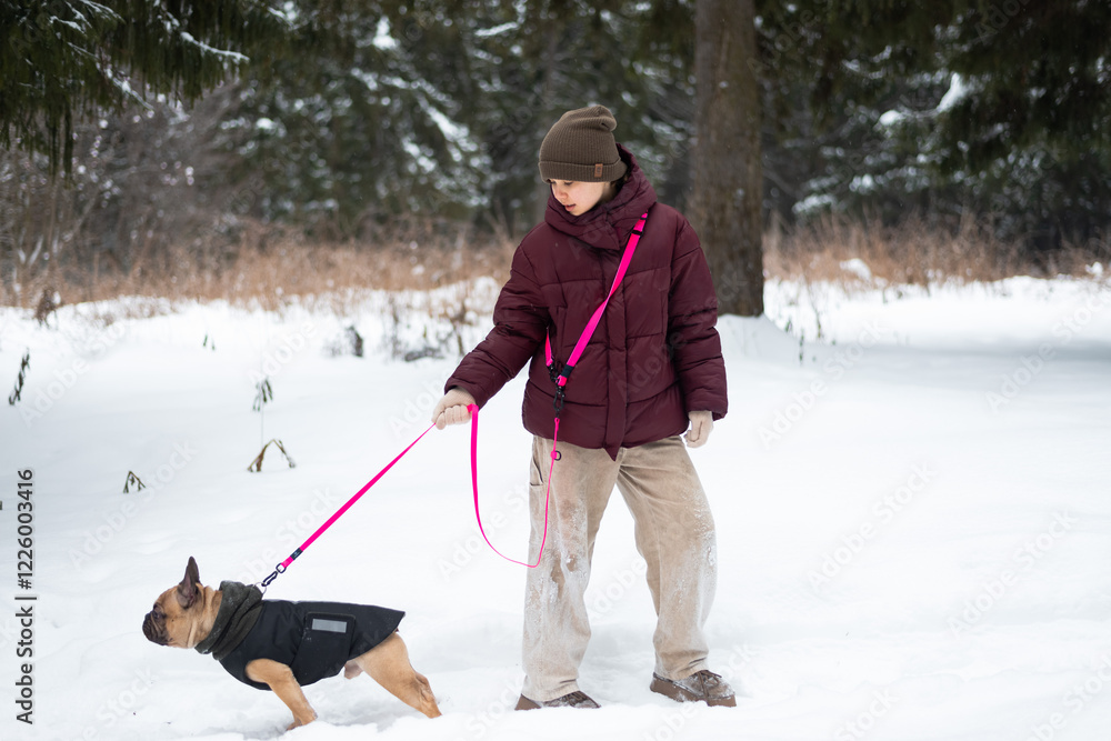 Winter walk with a dog in snowy forest, enjoying nature Winter walk with a dog in snowy forest, enjoying nature