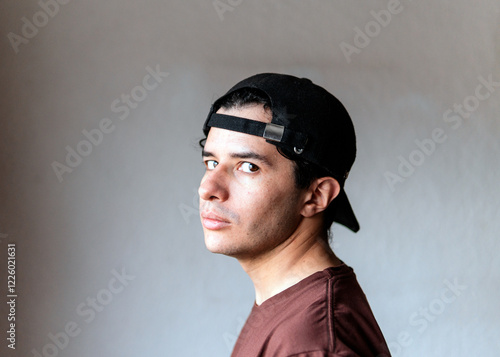 Young man wearing headset and cap in home remodeling scene photo