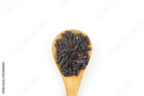 Black wild rice with bamboo spoon isolated on white background photo