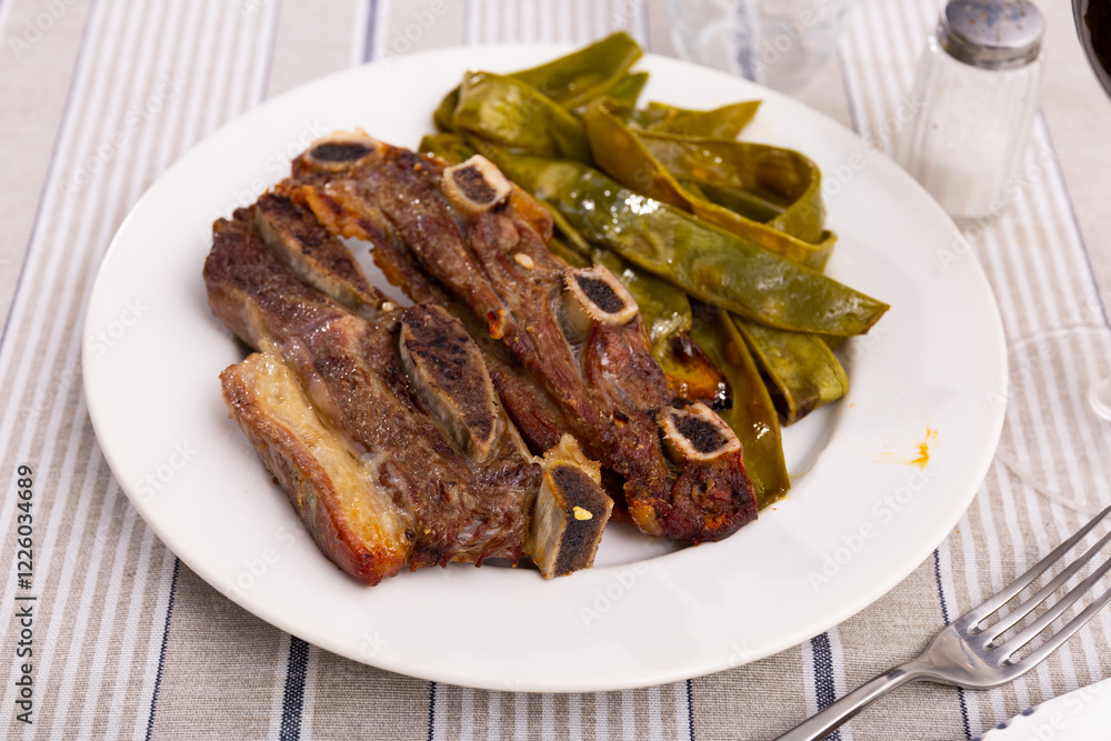 Appetizing roasted beef served with green beans on platter Appetizing roasted beef served with green beans on platter