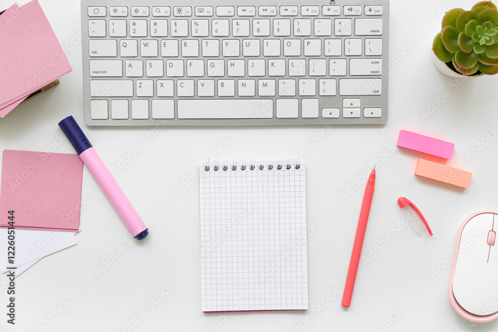 Composition with sticky notes, keyboard and notebook on white background Composition with sticky notes, keyboard and notebook on white background