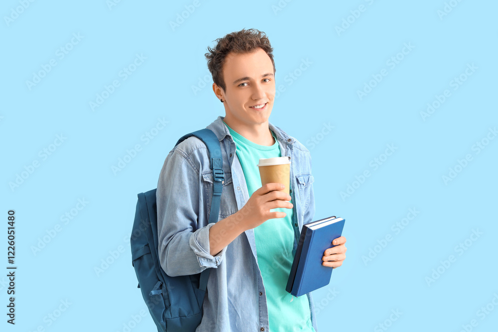 Male student with backpack, books and cup of coffee on blue background Male student with backpack, books and cup of coffee on blue background