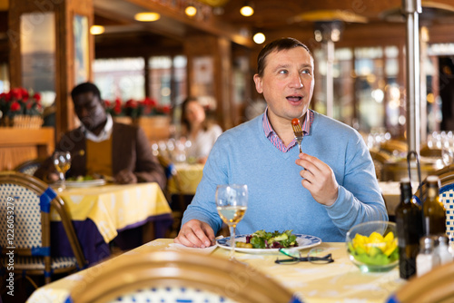 Wallpaper Mural Portrait of a man who lies in a restaurant hall Torontodigital.ca