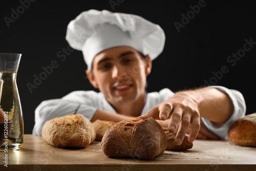 Handsome young chef with lo...