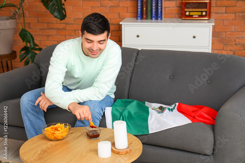 Young man with Mexican flag...