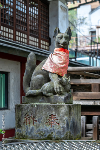 Photography Stone fox statue guarding a japanese shinto shrine