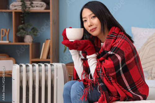 Young Asian woman with cup ...