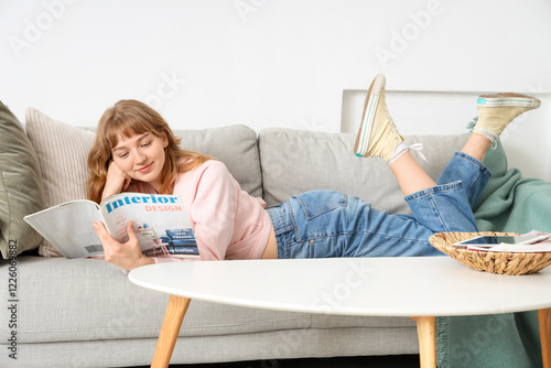 Young woman reading magazin...
