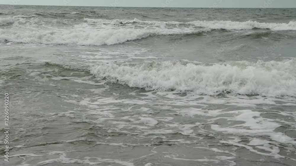 Slow-motion capture of sea waves crashing on the shore. Slow-motion capture of sea waves crashing on the shore.