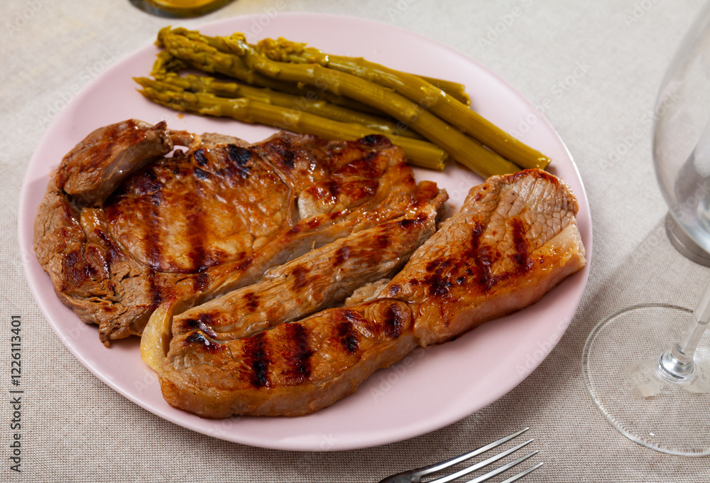 Appetizing beef steak with asparagus on plate Appetizing beef steak with asparagus on plate