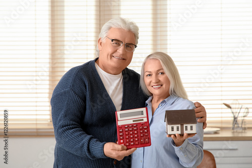 Senior couple with calculat...