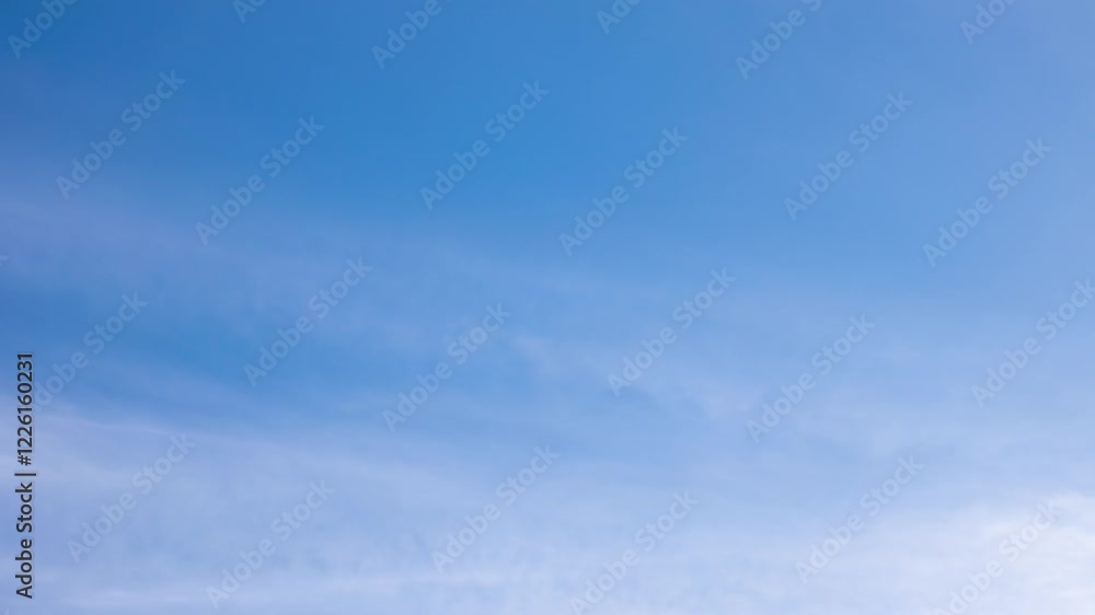 White clouds moving fast from right to left time-lapse. Daylight cloudy heaven background. Long timelapse light clouds transforming in blue sky with motion blur. Perfect for text, titles, logo White clouds moving fast from right to left time-lapse. Daylight cloudy heaven background. Long timelapse light clouds transforming in blue sky with motion blur. Perfect for text, titles, logo